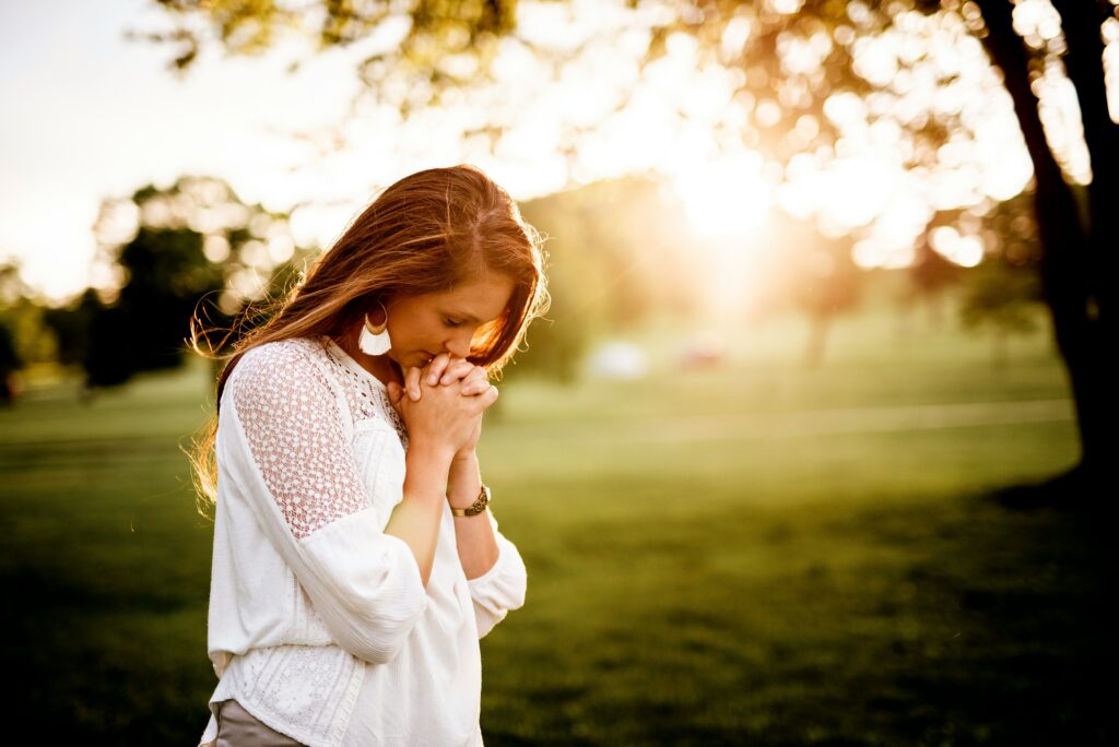 Woman outside praying