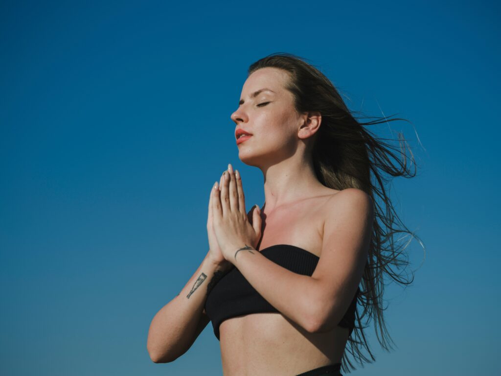 Woman doing a yoga pose outside